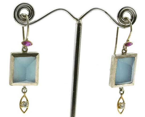 ...earrings with roughly bruted topas...